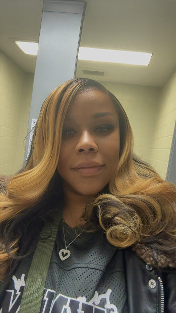 Close-up of woman wearing K R Raw Hair wig with sleek texture, natural shine, and full density